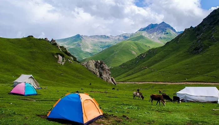 Rocky mountains and unpaved road across Badgoi Pass between Utror and Kumrat