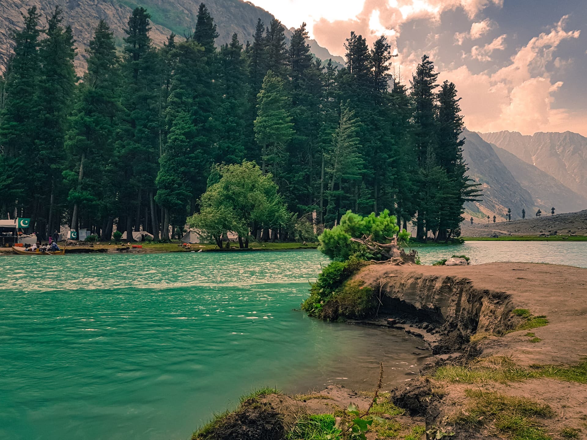 Blue-green water and pine forest at Saifullah Lake north of Kalam