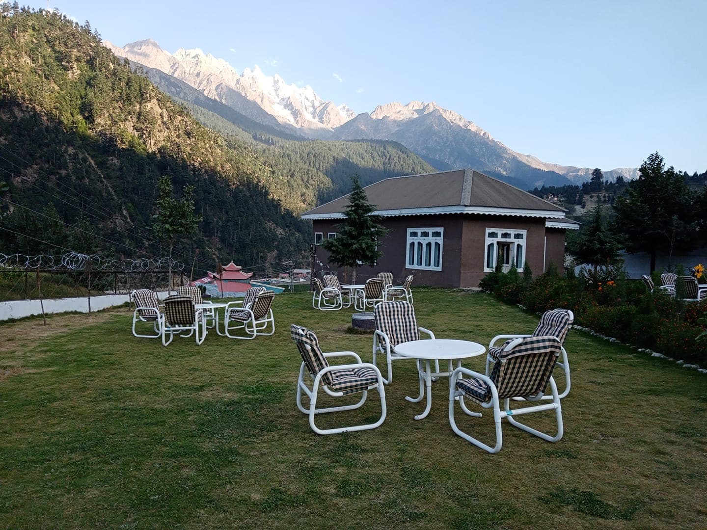 Garden seating facing the mountain ridge at Forest Valley Cottages