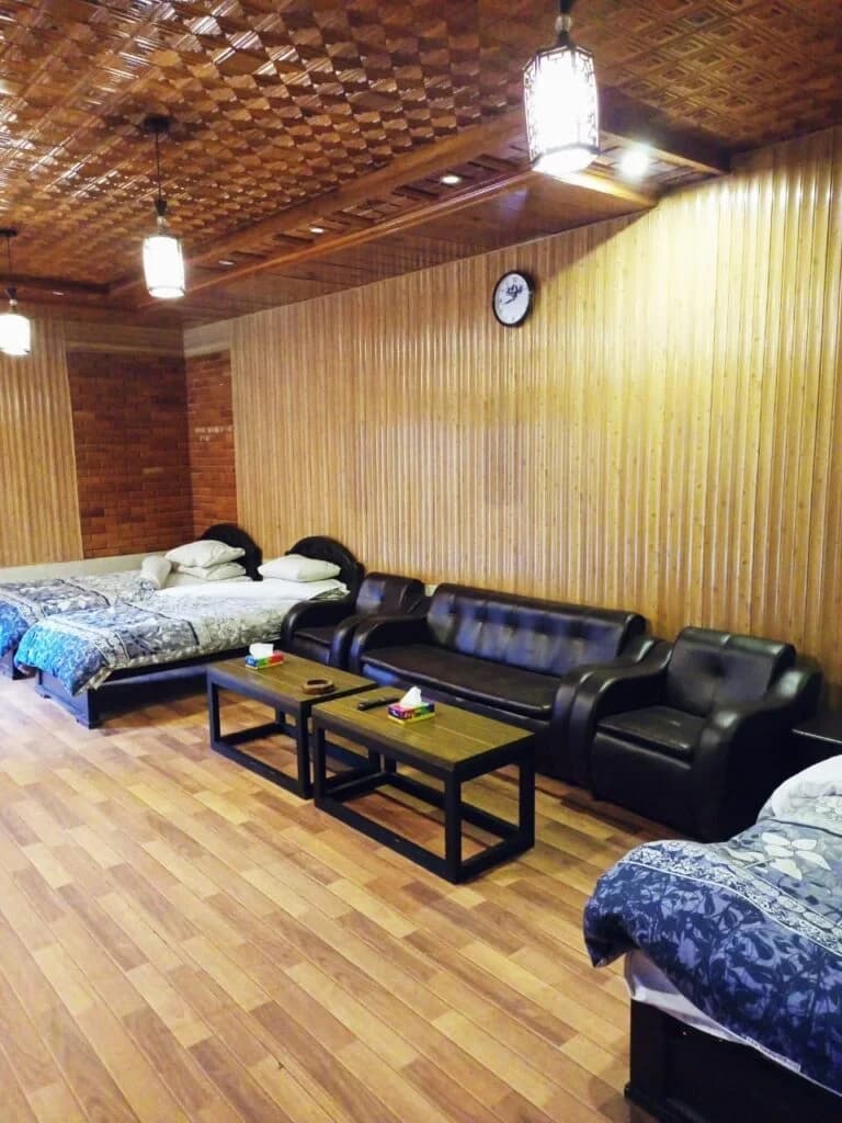 Spacious family room with multiple beds and lounge seating
